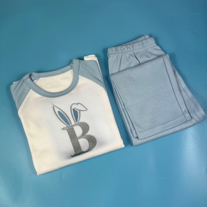 Blue pyjamas with a letter b with bunny ears
