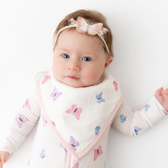 Soft bamboo baby footie with butterfly pattern, front view