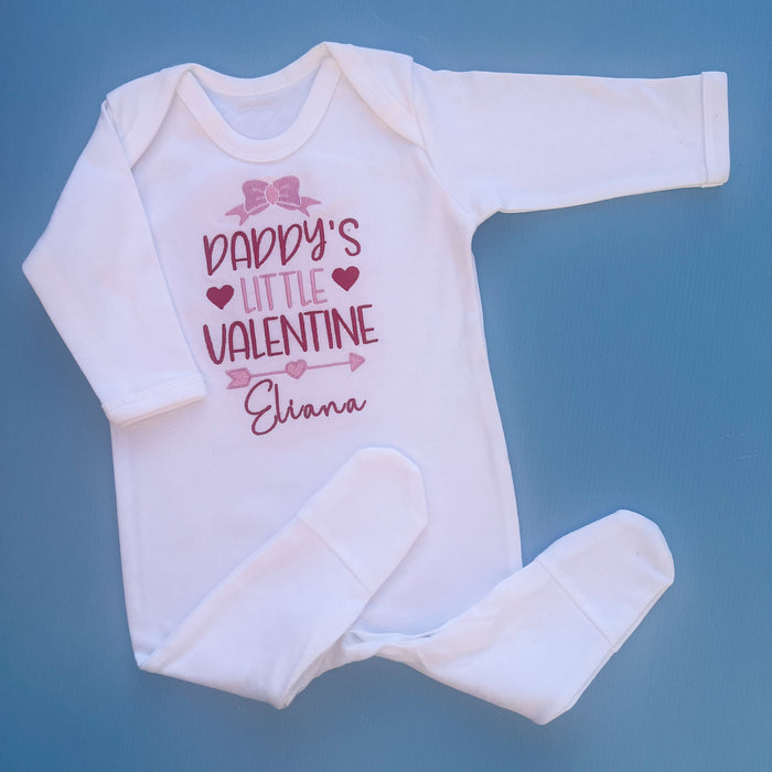White baby romper with daddy’s little valentine embroidered on the front