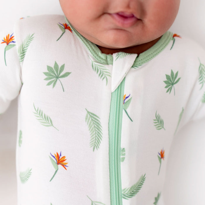 Bird of paradise bamboo footie on baby, full body view