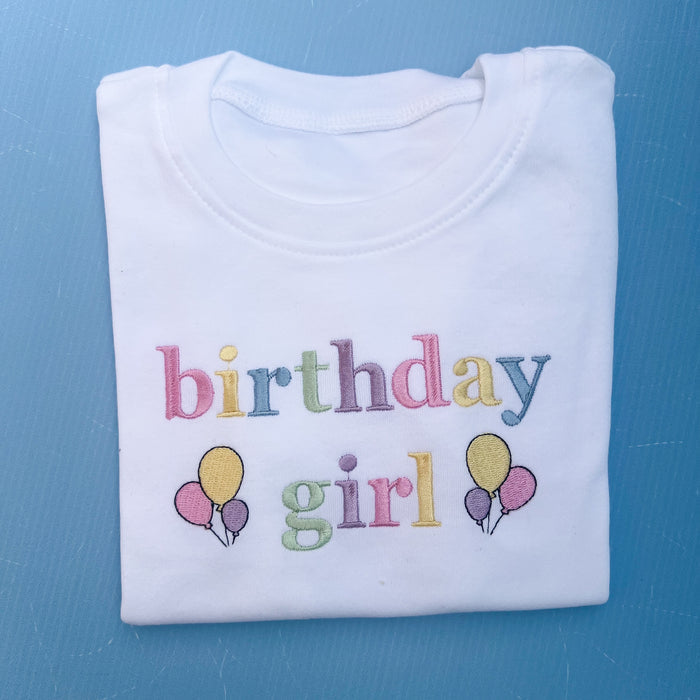 Folded birthday girl tshirt with pastels embroidery