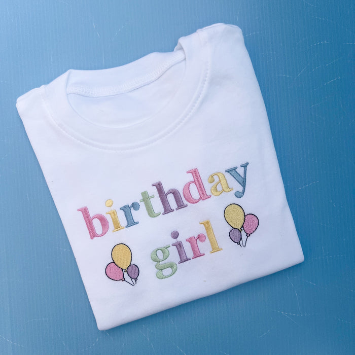 Folded birthday girl tshirt with pastels embroidery