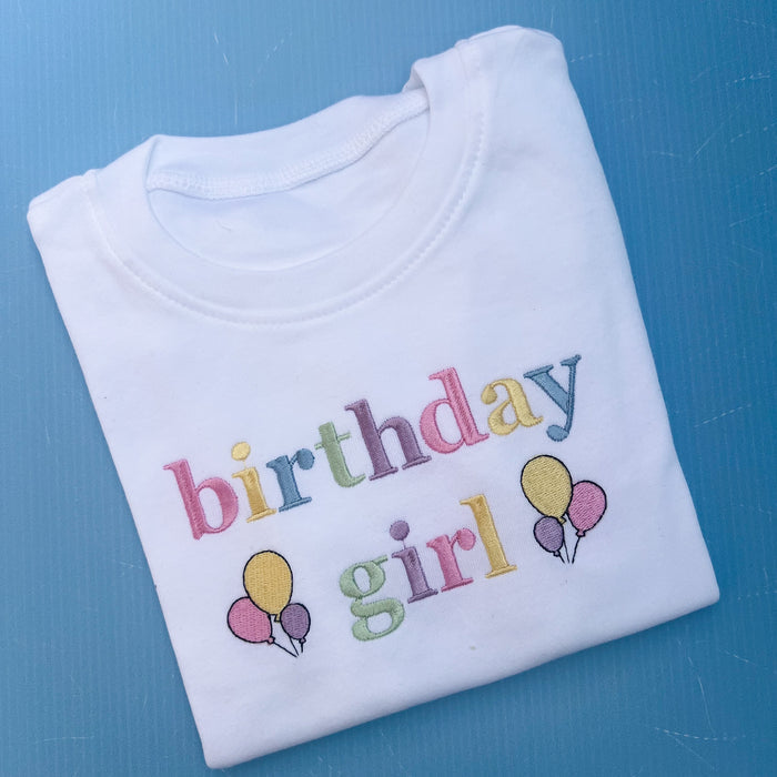 Folded birthday girl tshirt with pastels embroidery