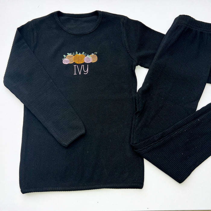 black loungewear with pink and orange pumpkins with name in pink