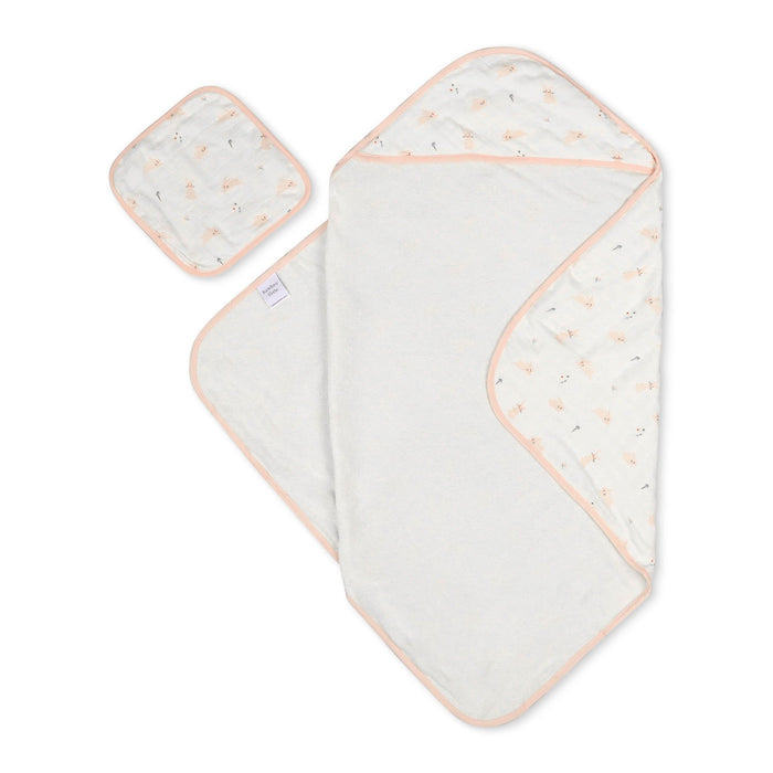 Baby towel and washcloth set with subtle pattern on a white background