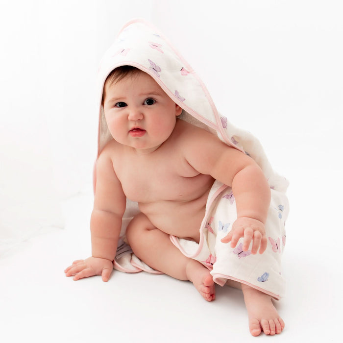 Baby in butterfly hooded towel after bath