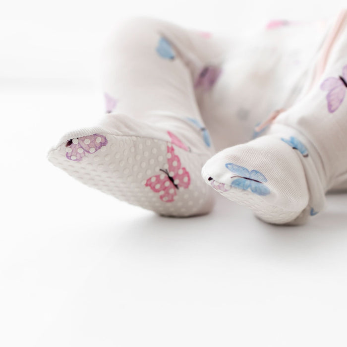 Soft bamboo baby footie with butterfly pattern, front view
