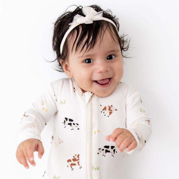 Cow print bamboo zippered footie, back view