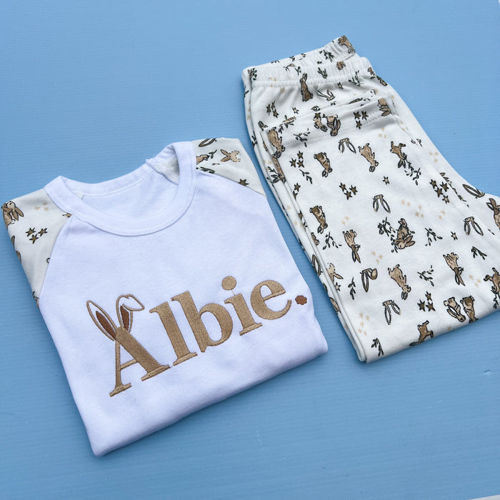 Rabbit printed pyjamas with child’s name Albie embroidered with bunny ears on the A