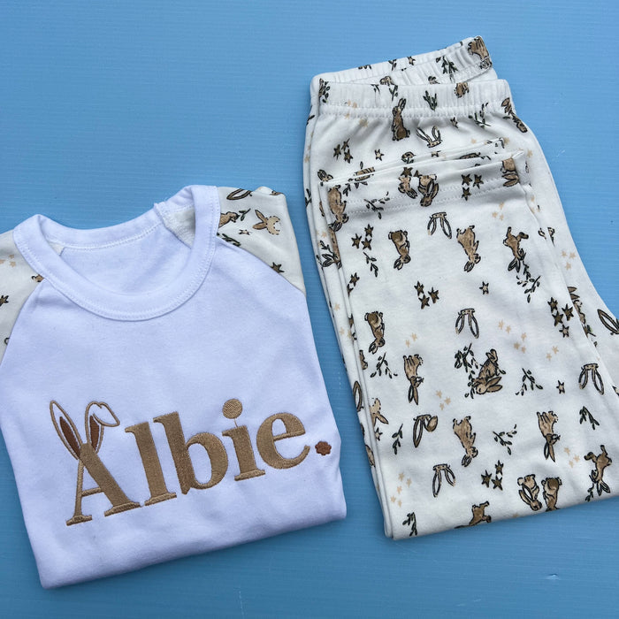 Rabbit printed pyjamas with child’s name Albie embroidered with bunny ears on the A