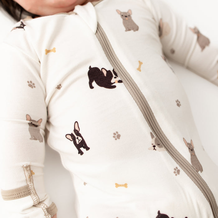 Close-up of soft bamboo fabric on french bulldog baby footie