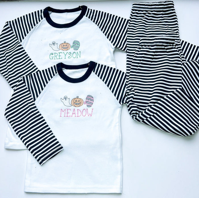 sketch design halloween pyjamas for girls and boys. embroidered with a ghost, mummy and pumpkin and finished with child's name