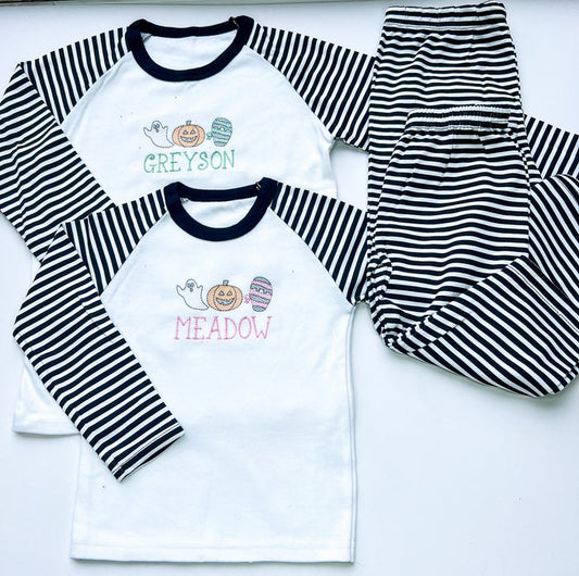 sketch design halloween pyjamas for girls and boys. embroidered with a ghost, mummy and pumpkin and finished with child's name