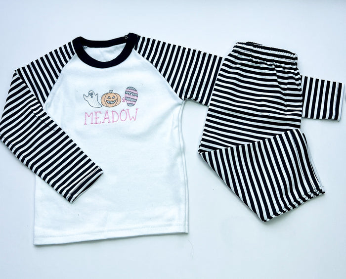 sketch design halloween pyjamas for girls and boys. embroidered with a ghost, mummy and pumpkin and finished with child's name