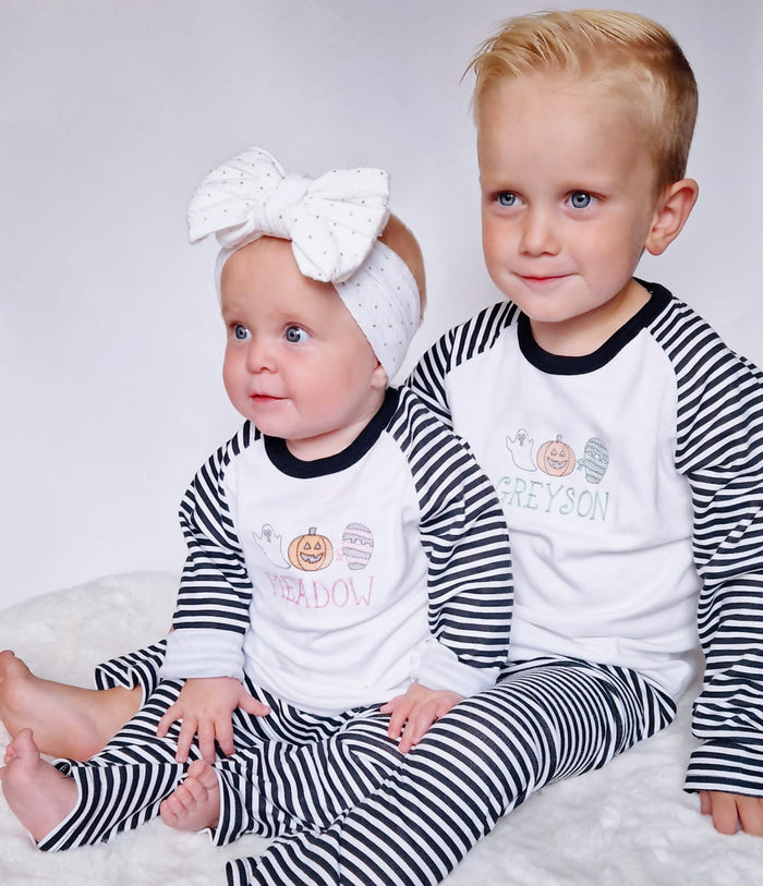 sketch design halloween pyjamas for girls and boys. embroidered with a ghost, mummy and pumpkin and finished with child's name