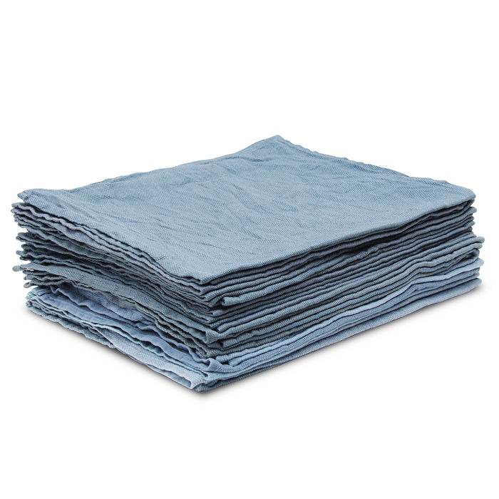 Stack of blue folded cloths on a white background