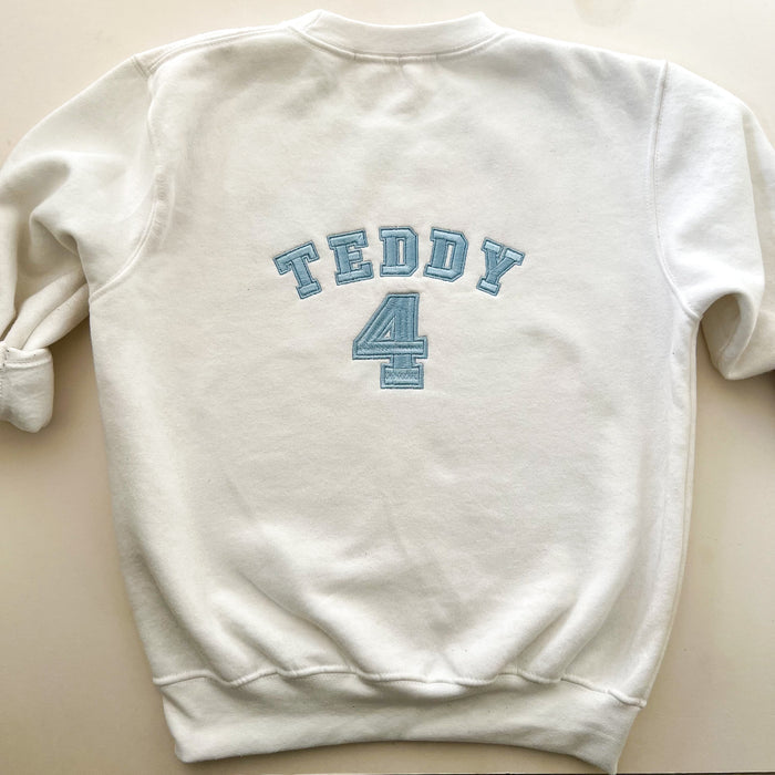 The back of a jumper with embroidery