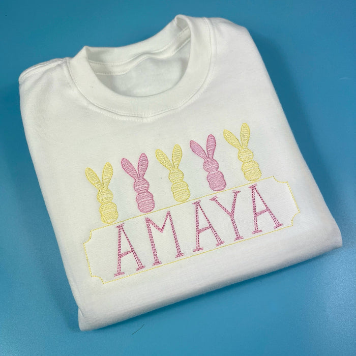 Easter embroidery design on a white sweatshirt