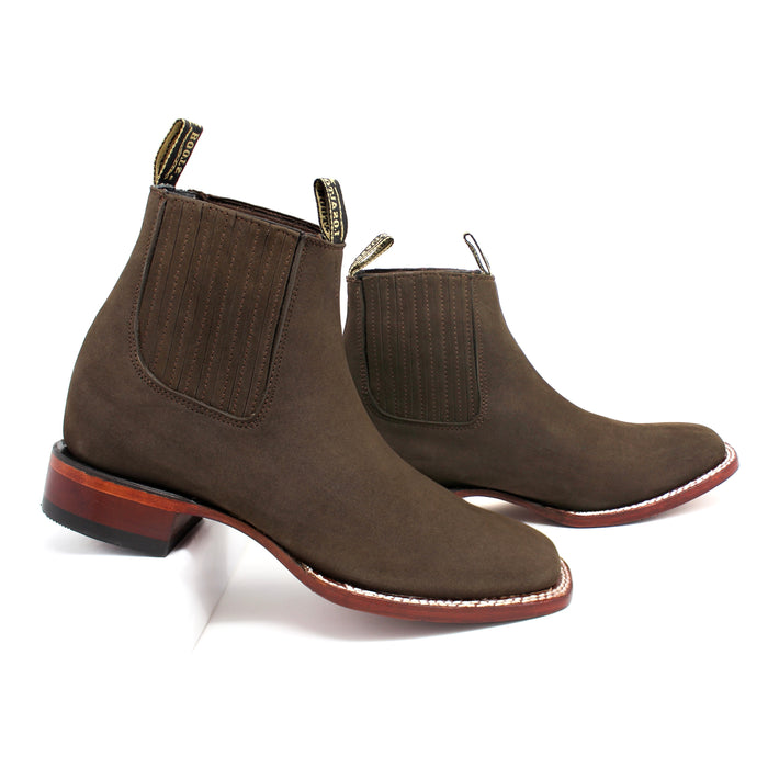 Side view of men’s Los Altos tabaco nobuck ankle boots with leather sole and elastic panels.