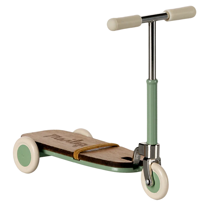 Children's scooter with wooden deck and green frame on a white background
