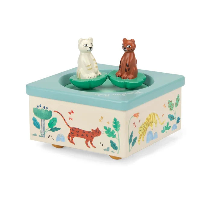 Toy music box with animal figures on a white background