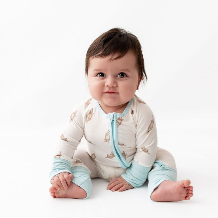 Convertible foot cuffs on bamboo otter baby romper