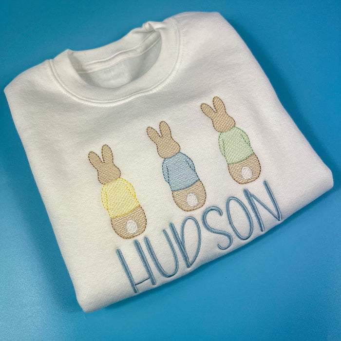 3 bunnies on a white sweatshirt with embroidered name