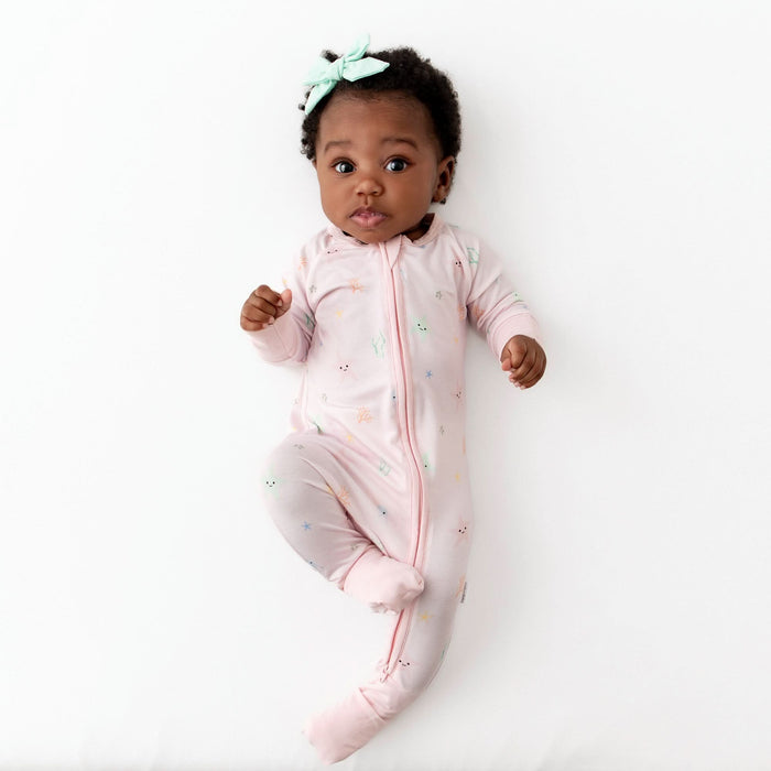 Convertible foot cuffs on starfish bamboo baby romper
