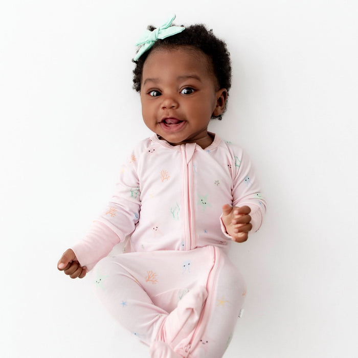 Baby wearing starfish bamboo convertible romper