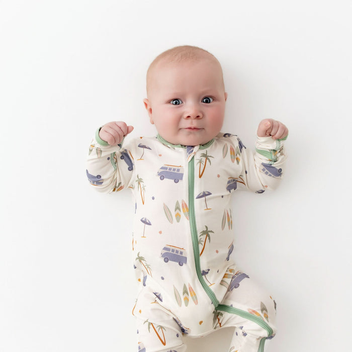 Close-up of zipper on surfboard print bamboo baby footie