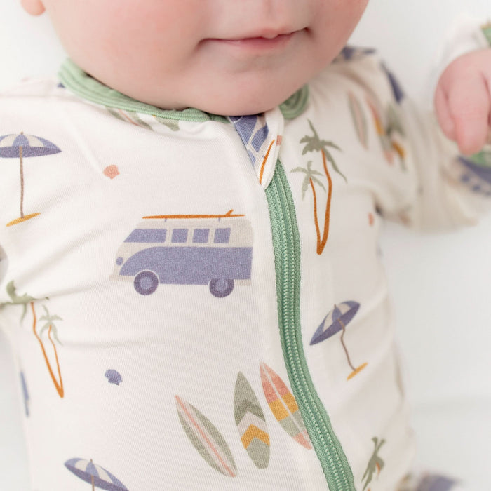 Close-up of zipper on surfboard print bamboo baby footie