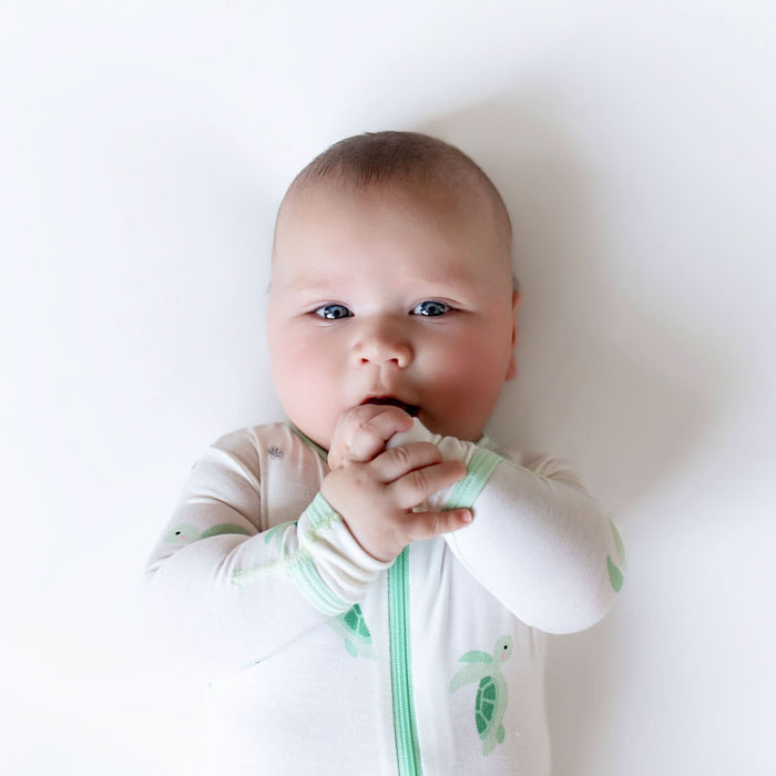 Turtle print bamboo zippered baby footie, detail view