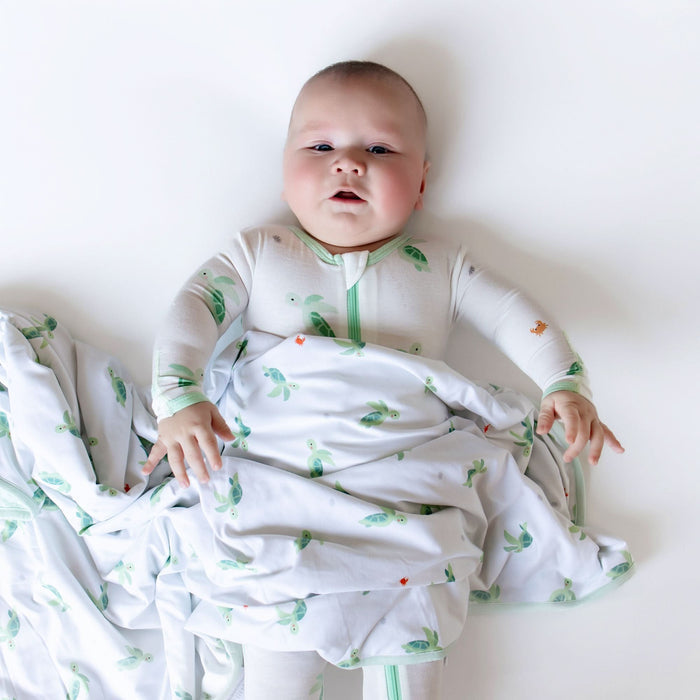 Baby wearing turtle bamboo zippered footie pajama