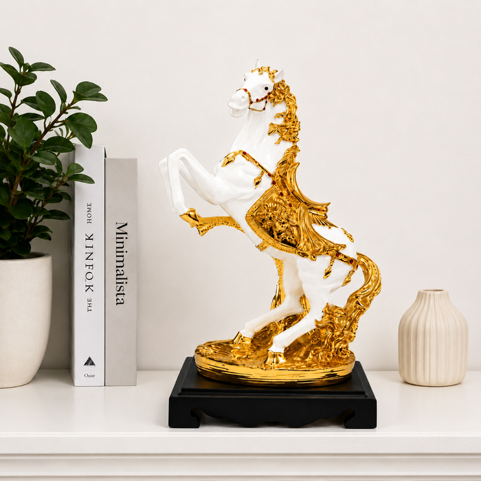 white and gold resin horse statue